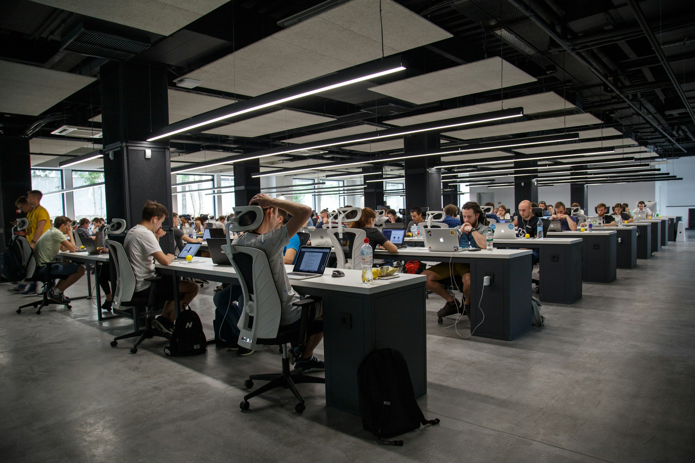 A modern workspace with monitors showing product designs