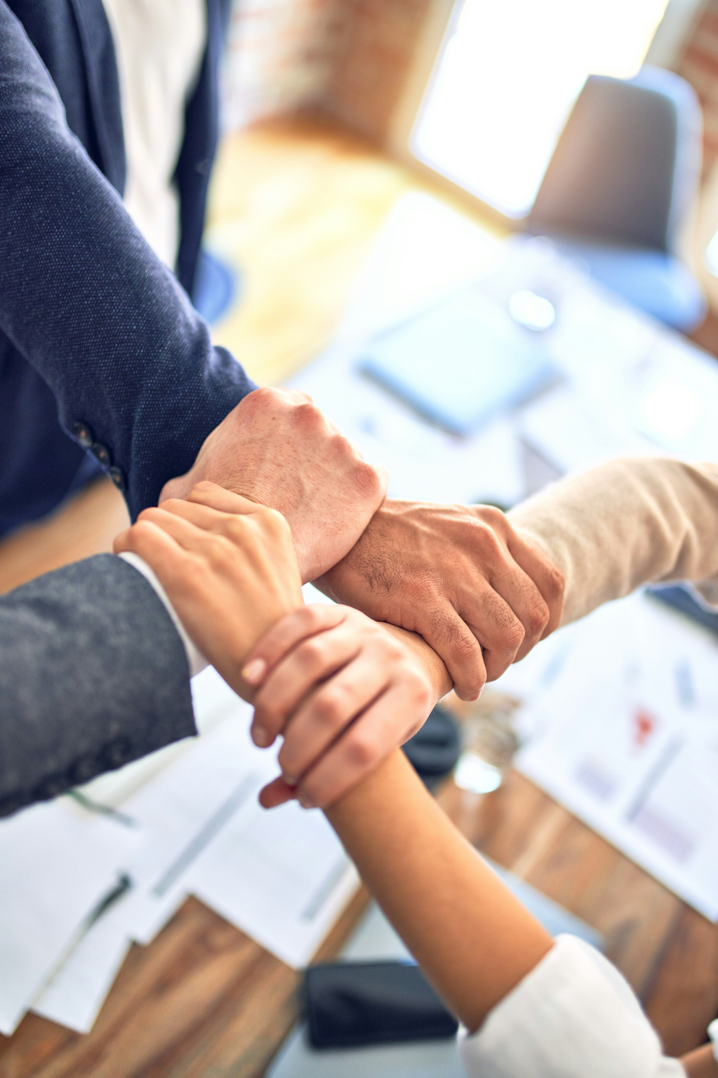 A team collaborating at a shared workspace